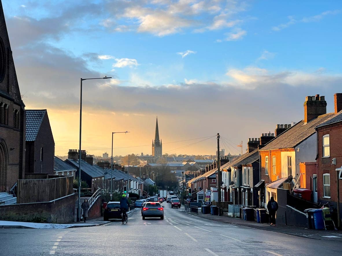 A street view overlooking Norwich in Norfolk showing the cathedral on the horizon